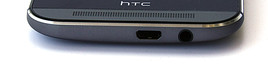Sous l'appareil : Micro USB avec interface MHL, prise jack audio stéréo.
