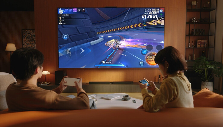 Le Huawei Mate TV Pro diffuse sans fil des jeux vidéo à partir d'un smartphone et se contrôle à l'aide d'une télécommande au trackpad inhabituel. (Source de l'image : Huawei)