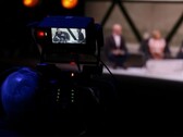 Une photo d'une caméra filmant une interview 