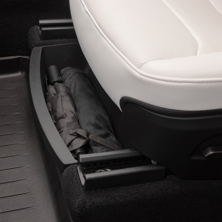 Plateau de rangement sous le siège du Model Y