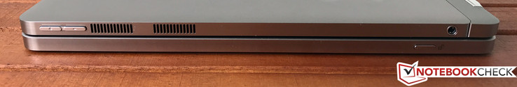 Côté droit: Touches de volume, aérations, prise jack stéréo 3,5 mm (sur la tablette), bouton de dé-enclenchement (sur le dock clavier)