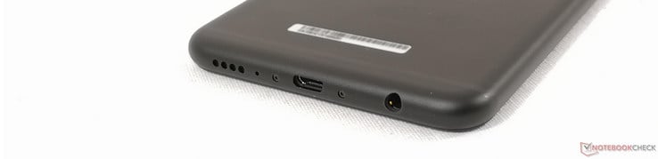 Au-dessous : haut-parleur, micro, 2 vis à tête hexagonale, micro USB, audio 3,5 mm