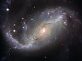 Image montrant la galaxie NGC 1672 et les étoiles de l'univers. (Source de l'image : WikiImages - Pixabay)