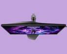 L'image montre l'écran de jeu AOC AG276UZ sur un fond violet. Cet écran de jeu présente un design très orienté gaming, avec notamment un éclairage RVB à l'arrière.