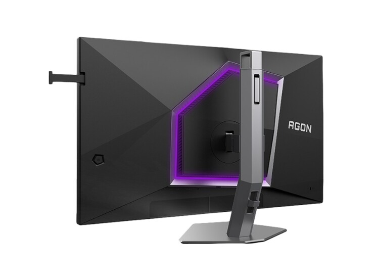 L'image montre l'arrière du moniteur de jeu AOC Agon Pro AG276UZ, qui arbore un design plutôt « gaming » avec un éclairage RVB violet.