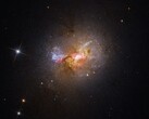 Image montrant la galaxie naine à flambée d'étoiles Henize 2-10.