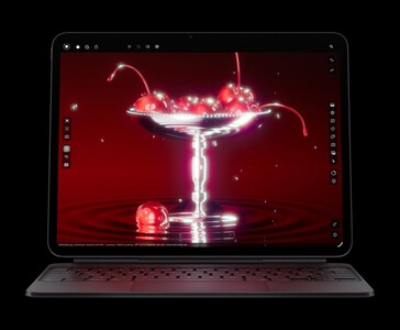 Apple iPad Pro M5 avec Magic Keyboard affichant un rendu 3D de cerises, mettant en valeur l'écran OLED Ultra Retina XDR et la puce graphique M5 (Image source : Apple)