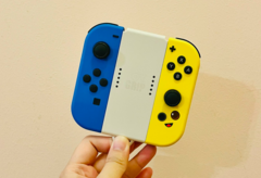 Image d'archive. Une main tenant des Joy-Cons (Source de l'image : Gwen King on Unsplash)