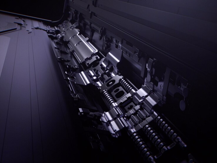 Gros plan sur la charnière d'un smartphone pliable avec des pièces métalliques et des ressorts, représentant l'ingénierie du pliage de l'iPhone sur le site Apple (Image source : Oppo)