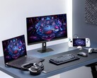 Moniteur de jeu Asus XG27UCMG aux côtés de divers appareils électroniques Asus