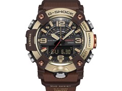 Gros plan sur la G-Shock Mudmaster GG-B100XMH-5A, mettant en valeur son boîtier et sa lunette de couleur or jaune clair et marron.