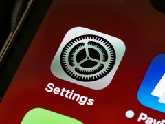 Gros plan sur l'icône de l'application « Réglages » sur l'écran d'un iPhone