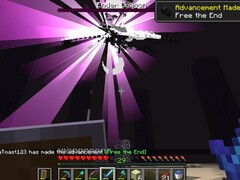 Une capture d'écran montrant un utilisateur en train de vaincre l'Ender Dragon dans Minecraft