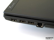 Trois ports USB 2.0 supplémentaires sur le bord suivi d'un RJ-11.