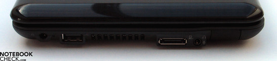 Flanc gauche: Connexion réseau, USB 2.0, Port d'extension, audio, LAN (derrière le bouchon en caoutchouc)