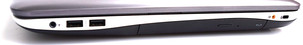 A droite : jack stéréo combiné, 2 ports USB 3.0, lecteur Blu-Ray, port subwoofer, verrou Kensington