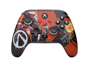 La manette de Borderlands 4 arbore des couleurs orange et noires avec des peintures murales et des logos tirés du jeu. (Source de l'image : PowerA)