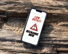 écran de l'iPhone affichant un message d'avertissement persistant de faible recharge de données. (Source de l'image : Arpit Brandings via Pexels, modifiée)