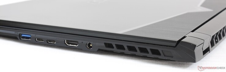 Côté droit : USB A 3.1, USB C + Thunderbolt 3, USB C + DisplayPort 1.4, HDMI 2.0, adaptateur secteur.