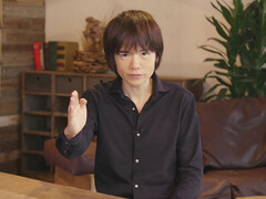 Masahiro Sakurai, créateur de jeux Nintendo, assis à une table (Source : The Guardian)
